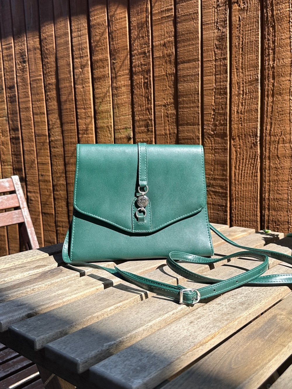 Stylish Green Leather Crossbody Bag with Polished Hardware